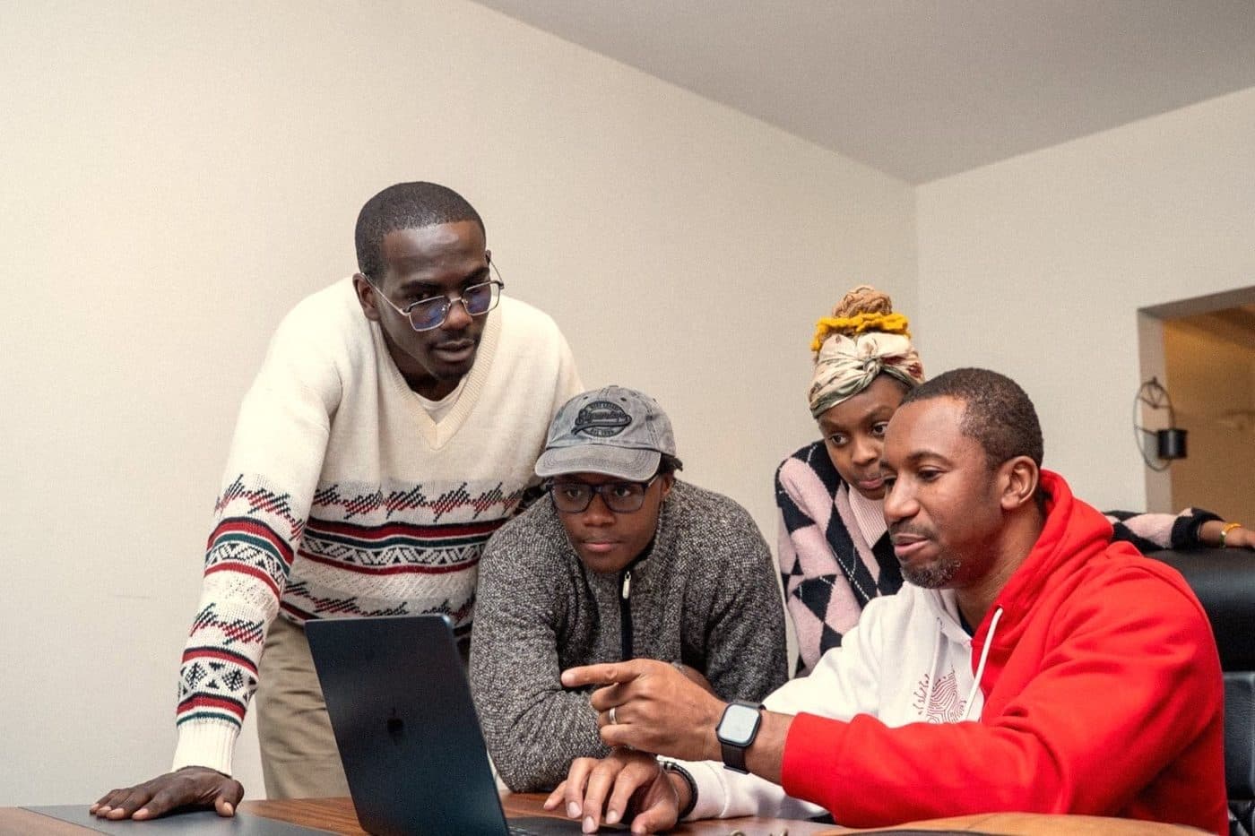 Founders working together around a laptop at Hackhouse Africa, 124 Manyani East Road, Nairobi